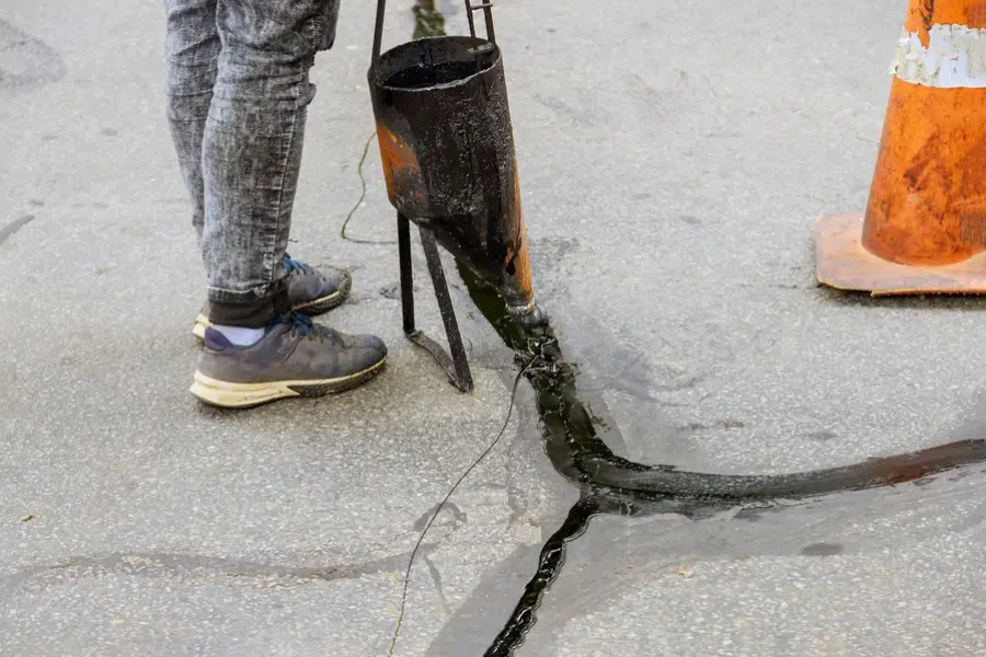 How Sealcoating Protects Asphalt From Cracks And Damage in Syracuse, NY
